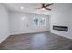 Modern living room with wood-look floors, modern fireplace and lots of natural light from the windows at 3762 Larkspur Ter, Decatur, GA 30032