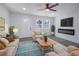 Cozy living room with natural light, modern fireplace, wood-look floors and comfortable seating area at 3762 Larkspur Ter, Decatur, GA 30032