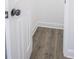 This image shows a walk-in closet with grey laminate floors and white trim at 3762 Larkspur Ter, Decatur, GA 30032