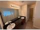 Bright Primary bathroom with double sinks, granite countertops, and a luxurious soaking tub at 3963 Lucas Ln, Ellenwood, GA 30294