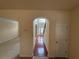 Inviting foyer with hardwood floors and a view of the grand staircase and front door at 3963 Lucas Ln, Ellenwood, GA 30294