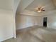 Large main bedroom with a tray ceiling, plush carpet, and plenty of natural light at 3963 Lucas Ln, Ellenwood, GA 30294