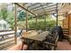 Brick patio with outdoor dining set under a decorative pergola at 4162 Brownlee Dr, Tucker, GA 30084