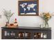 Stylish bar area with glass storage, decorative world map, and elegant drinkware at 4162 Brownlee Dr, Tucker, GA 30084
