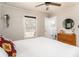 Neutral bedroom featuring a wood dresser and views of the ensuite bathroom at 4162 Brownlee Dr, Tucker, GA 30084