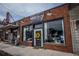 Brick building featuring Wine & Whimseys retail business with street front parking and sidewalk access at 4162 Brownlee Dr, Tucker, GA 30084