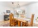 Well-lit dining room features a wood table, rug, modern light fixture, and white walls at 4162 Brownlee Dr, Tucker, GA 30084