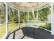 Outdoor gazebo featuring a porch swing, ceiling fan, and wooded scenery, offering a serene backyard retreat at 4162 Brownlee Dr, Tucker, GA 30084