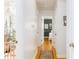 Bright hallway with hardwood floors leading to bedrooms and featuring colorful wall decor at 4162 Brownlee Dr, Tucker, GA 30084