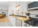 Inviting kitchen featuring stainless steel appliances, butcher block counters, and patterned flooring at 4162 Brownlee Dr, Tucker, GA 30084
