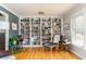 Inviting living room featuring hardwood floors, large bookshelves, and comfortable seating at 4162 Brownlee Dr, Tucker, GA 30084