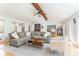 Open living room with vaulted ceiling, beam, and comfortable seating at 4162 Brownlee Dr, Tucker, GA 30084