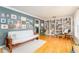 Bright living room displaying hardwood floors, large windows, gallery wall, and built-in bookshelves at 4162 Brownlee Dr, Tucker, GA 30084