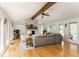 Bright living room featuring a vaulted ceiling, stone fireplace, hardwood floors and large windows at 4162 Brownlee Dr, Tucker, GA 30084