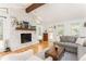 Cozy living room with stone fireplace, wood mantel, and ample natural light at 4162 Brownlee Dr, Tucker, GA 30084