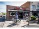 Village Burger restaurant featuring a brick exterior, outdoor tables, and a welcoming entrance at 4162 Brownlee Dr, Tucker, GA 30084