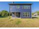 Exterior view of the house with a covered porch and a large lawn, offering plenty of space for outdoor enjoyment at 417 Flowery Branch Ct, Villa Rica, GA 30180