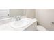 Clean bathroom with a vanity featuring a white marble countertop, sink, and fixtures at 417 Flowery Branch Ct, Villa Rica, GA 30180
