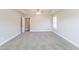 Large carpeted bedroom featuring tray ceiling and neutral paint at 417 Flowery Branch Ct, Villa Rica, GA 30180