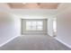 Spacious carpeted bedroom with large windows offering natural light at 417 Flowery Branch Ct, Villa Rica, GA 30180