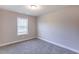 Carpeted bedroom with one window providing natural light at 417 Flowery Branch Ct, Villa Rica, GA 30180