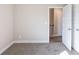Bedroom with carpet and a door and closet visible at 417 Flowery Branch Ct, Villa Rica, GA 30180