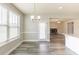 Cozy dining area featuring laminate floors, modern lighting, and access to a backyard at 417 Flowery Branch Ct, Villa Rica, GA 30180