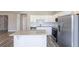 Well-equipped kitchen with an island, stainless steel appliances, and ample counter space at 417 Flowery Branch Ct, Villa Rica, GA 30180