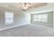 Expansive main bedroom with a trey ceiling, ceiling fan, and plush carpet flooring at 417 Flowery Branch Ct, Villa Rica, GA 30180