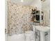 Compact bathroom with patterned shower curtain and white fixtures at 1 S Prado Ne # 15, Atlanta, GA 30309