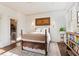 Charming bedroom with hardwood floors, large window, and decorative artwork at 1 S Prado Ne # 15, Atlanta, GA 30309