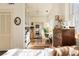 Sunlit dining room with hardwood floors and built-in storage and a peek into an adjacent bedroom at 1 S Prado Ne # 15, Atlanta, GA 30309