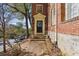 Brick condo exterior with a brick walkway leading to the main entrance and surrounding landscaping at 1 S Prado Ne # 15, Atlanta, GA 30309