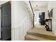 Hallway view with carpeted stairs and a black door at the end of the corridor at 1 S Prado Ne # 15, Atlanta, GA 30309