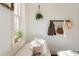 Sunlit living room highlighting a quaint corner with a window, decorative wall accents, and comfortable seating at 1 S Prado Ne # 15, Atlanta, GA 30309