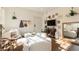 Cozy living room with bright white walls and decor, adorned with unique wall hangings and comfortable seating arrangements at 1 S Prado Ne # 15, Atlanta, GA 30309