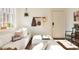 Bright living room features sunlight streaming through the window, accentuating the white sofa and minimal decor at 1 S Prado Ne # 15, Atlanta, GA 30309
