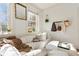 Bright living room features a comfortable white couch and a large window for natural light at 1 S Prado Ne # 15, Atlanta, GA 30309