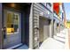Modern townhome featuring a gray door, siding, and garage with clean lines and new construction at 140 Color Cir, Atlanta, GA 30317