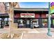 Charming neighborhood store with a dark brick facade and black awning, offering pet supplies at 140 Color Cir, Atlanta, GA 30317