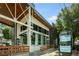 Modern commercial building showcasing large windows, an awning, and outdoor seating at 140 Color Cir, Atlanta, GA 30317