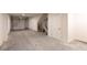 Spacious garage with white walls, concrete floor, and a large roll-up door at 140 Color Cir, Atlanta, GA 30317