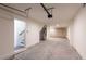 Spacious garage with white walls and concrete floor; ready for parking and storage at 140 Color Cir, Atlanta, GA 30317