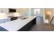 Modern kitchen features white cabinets, stainless steel appliances, and a spacious island with sink at 140 Color Cir, Atlanta, GA 30317