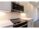 Bright kitchen featuring stainless steel appliances, a modern oven, and ample counter space at 140 Color Cir, Atlanta, GA 30317