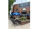 The Argonaut restaurant boasts an outdoor seating area under blue umbrellas at 140 Color Cir, Atlanta, GA 30317