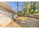 Expansive backyard showing the home's exterior with mature trees at 3475 Glensford Dr, Decatur, GA 30032