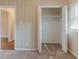 Bedroom with neutral walls, carpet, and a closet with shelf at 3475 Glensford Dr, Decatur, GA 30032
