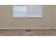 Bedroom featuring neutral carpet and walls, and a window with blinds at 3475 Glensford Dr, Decatur, GA 30032