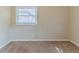 Neutral bedroom featuring a window with blinds and carpet at 3475 Glensford Dr, Decatur, GA 30032